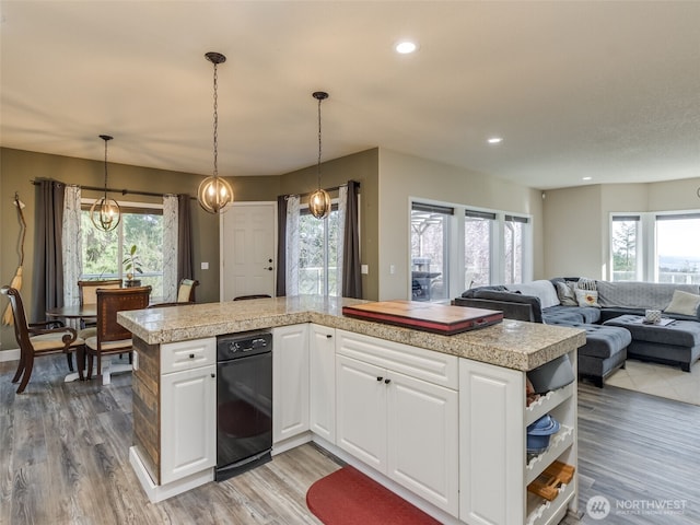 kitchen featuring tile countertops, a healthy amount of sunlight, and open shelves