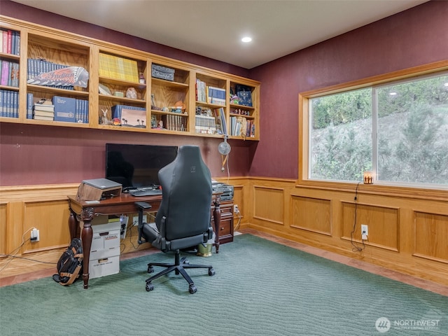 office featuring plenty of natural light, carpet flooring, and a wainscoted wall