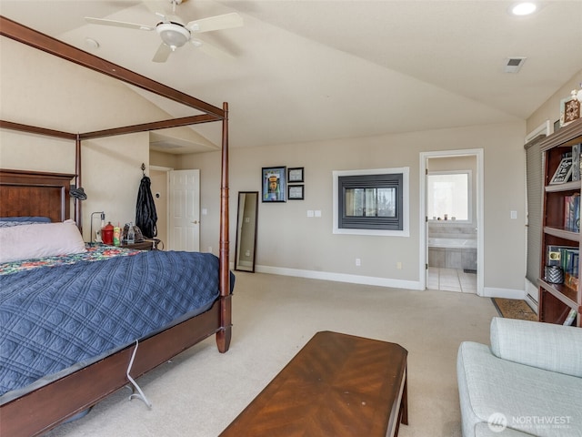 carpeted bedroom with vaulted ceiling, a ceiling fan, ensuite bathroom, baseboards, and visible vents