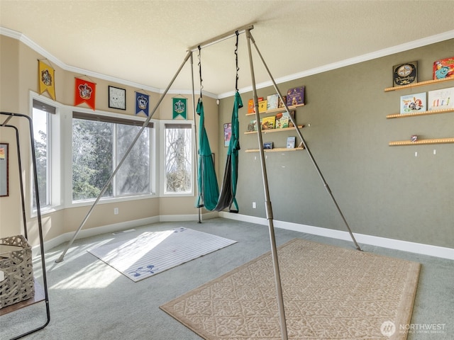 interior space with carpet flooring, crown molding, baseboards, and visible vents