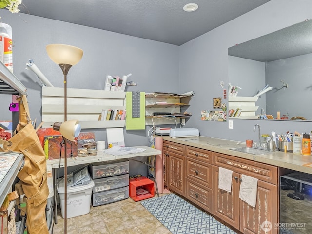 interior space with beverage cooler and a sink