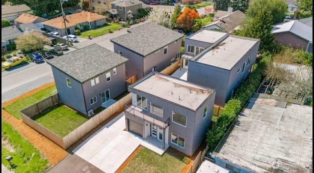 birds eye view of property with a residential view