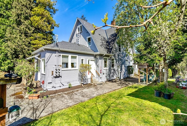 3512 Grand Ave, Everett, WA 98201 - back of house featuring a yard, entry steps, and a shingled roof