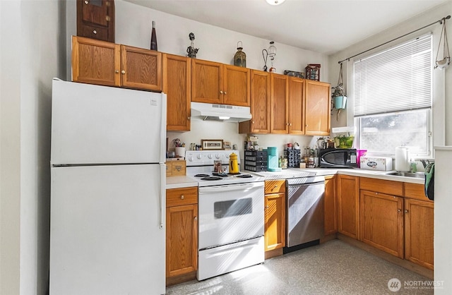3512 Grand Ave, Everett, WA 98201 - kitchen with brown cabinets, under cabinet range hood, white appliances, and light countertops