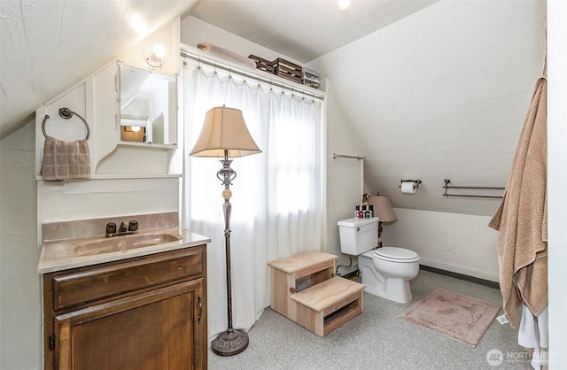 3512 Grand Ave, Everett, WA 98201 - full bathroom featuring vaulted ceiling, toilet, and vanity