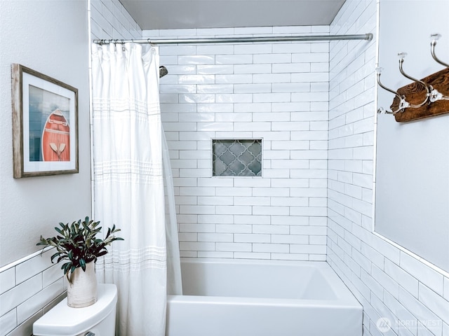 full bath featuring tile walls, toilet, and shower / bathtub combination with curtain
