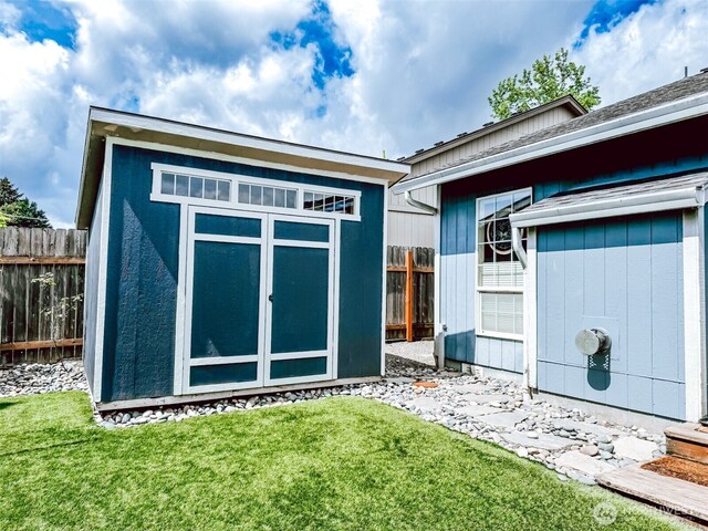 view of shed with fence