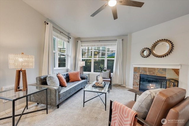3116 164th St SW Unit 2101, Lynnwood, WA 98087 - living area featuring light colored carpet, a ceiling fan, a tile fireplace, and baseboards