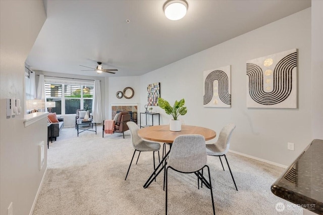 3116 164th St SW Unit 2101, Lynnwood, WA 98087 - dining space featuring ceiling fan, light colored carpet, and baseboards