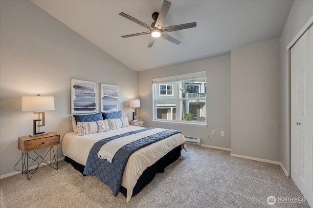 3116 164th St SW Unit 2101, Lynnwood, WA 98087 - carpeted bedroom with a baseboard radiator, lofted ceiling, baseboards, a closet, and ceiling fan