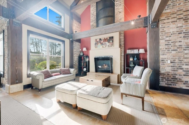 3116 164th St SW Unit 2101, Lynnwood, WA 98087 - living area with a towering ceiling, a lit fireplace, and beam ceiling