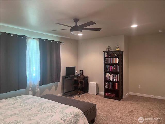 bedroom featuring baseboards, ceiling fan, and carpet floors