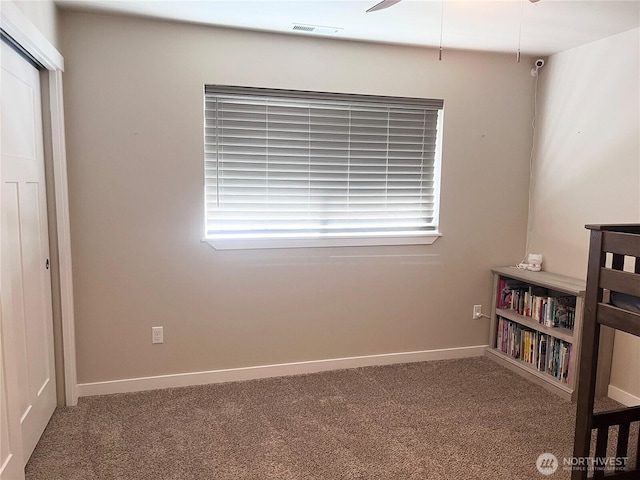 carpeted bedroom featuring visible vents and baseboards