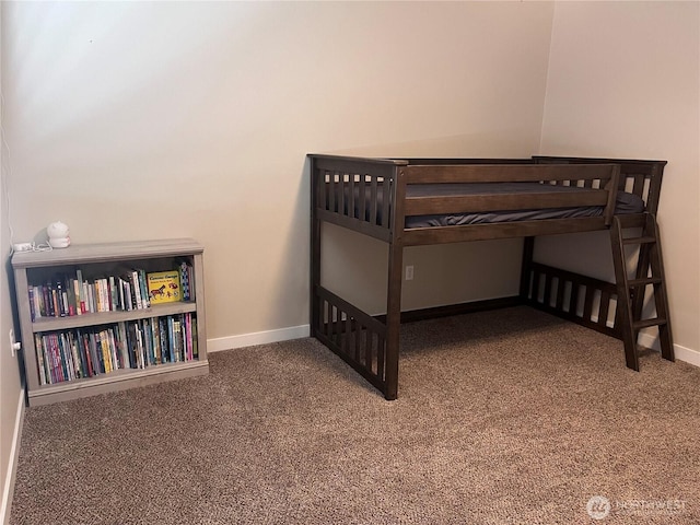 bedroom with carpet floors and baseboards
