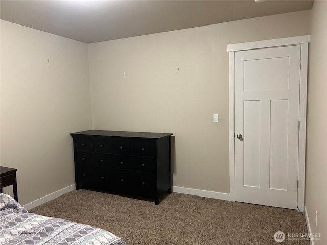 bedroom featuring baseboards and carpet floors