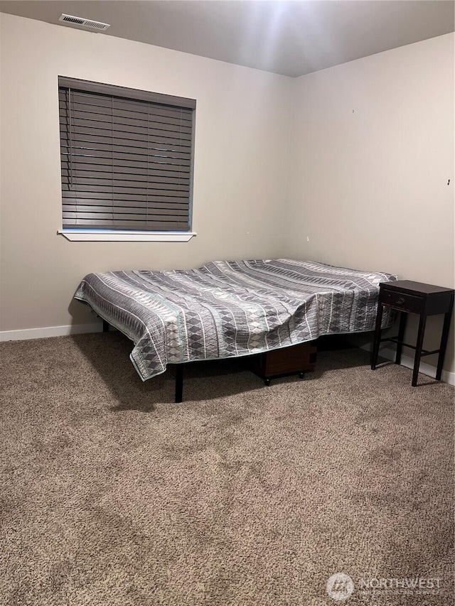 bedroom with visible vents, baseboards, and carpet floors
