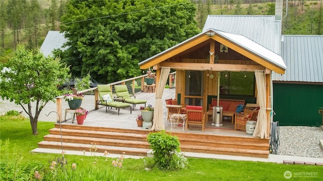 240 Mcfarland Creek Rd, Methow, WA 98834 - exterior space featuring metal roof, a wooden deck, and a lawn