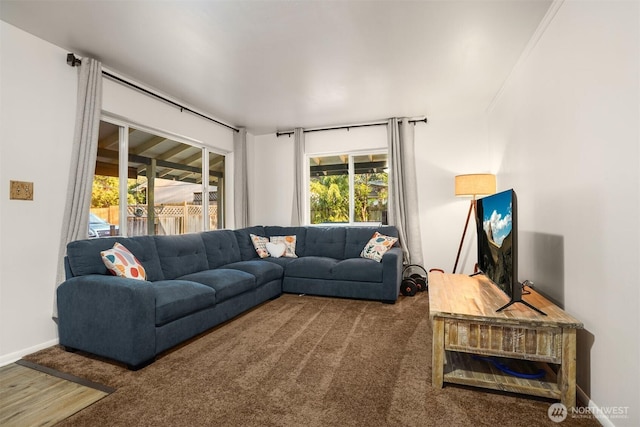 carpeted living room with baseboards