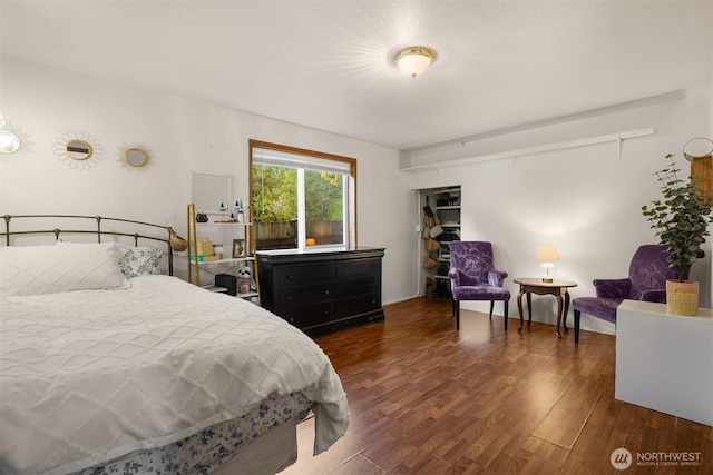 bedroom featuring wood finished floors