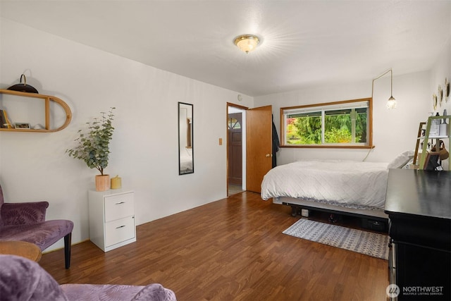 bedroom with wood finished floors