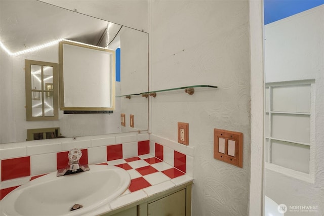 bathroom with backsplash and vanity