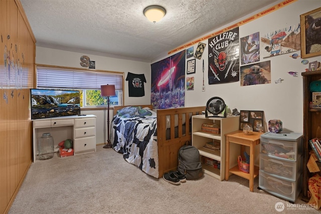 carpeted bedroom with a textured ceiling