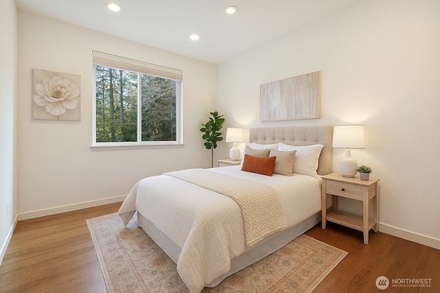 10788 243rd Ave NE, Redmond, WA 98053 - bedroom with recessed lighting, baseboards, and wood finished floors