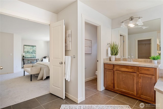 10788 243rd Ave NE, Redmond, WA 98053 - bathroom with tile patterned floors, vanity, toilet, and connected bathroom