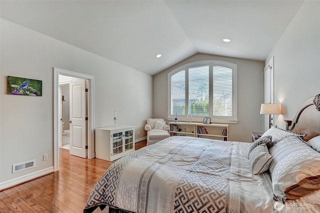 bedroom with visible vents, lofted ceiling, wood finished floors, baseboards, and recessed lighting