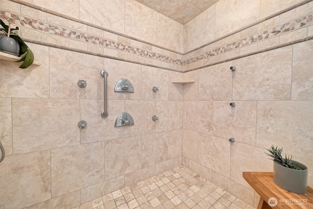 full bath with a tile shower
