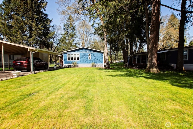 view of yard featuring a carport