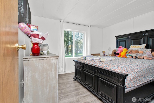 bedroom with light wood finished floors