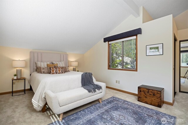 carpeted bedroom with baseboards and a textured ceiling