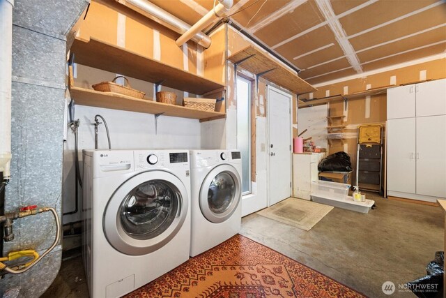 washroom featuring washer and dryer