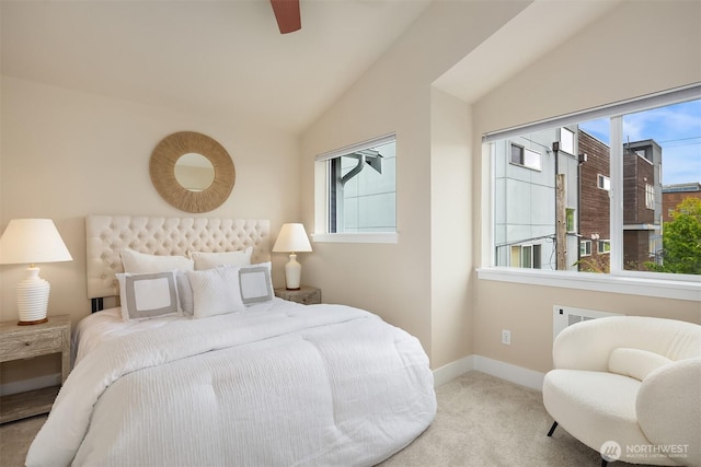 bedroom with carpet floors, a ceiling fan, baseboards, and vaulted ceiling