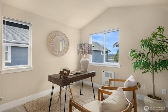 carpeted office space with baseboards, vaulted ceiling, and visible vents