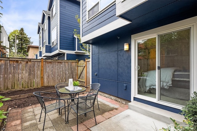 view of patio featuring fence