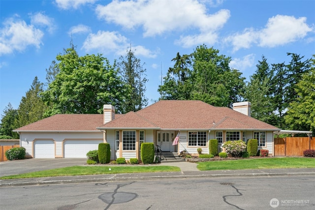 10116 SE 188th St, Renton, WA 98055 - single story home with a chimney, asphalt driveway, and a garage