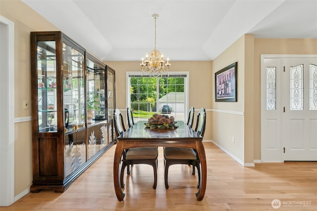 10116 SE 188th St, Renton, WA 98055 - dining room featuring a chandelier, light wood-style flooring, and baseboards