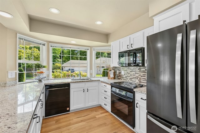 10116 SE 188th St, Renton, WA 98055 - kitchen featuring black appliances, a sink, backsplash, white cabinetry, and recessed lighting
