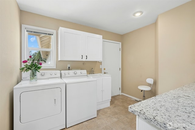 10116 SE 188th St, Renton, WA 98055 - washroom featuring washing machine and dryer, cabinet space, and baseboards