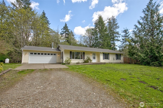 ranch-style house with a garage, dirt driveway, a front yard, and fence