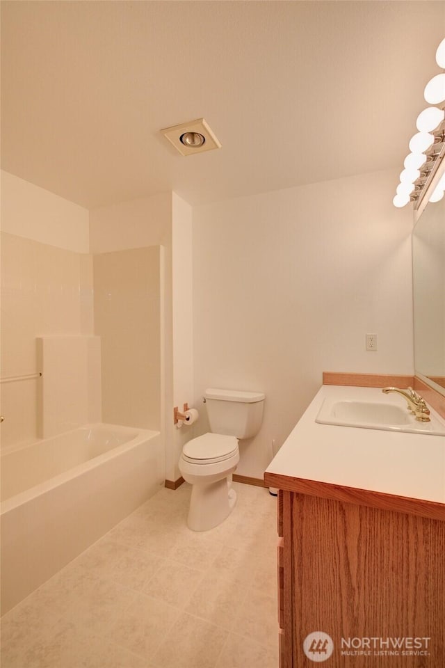 full bathroom with baseboards, shower / bath combination, vanity, and toilet