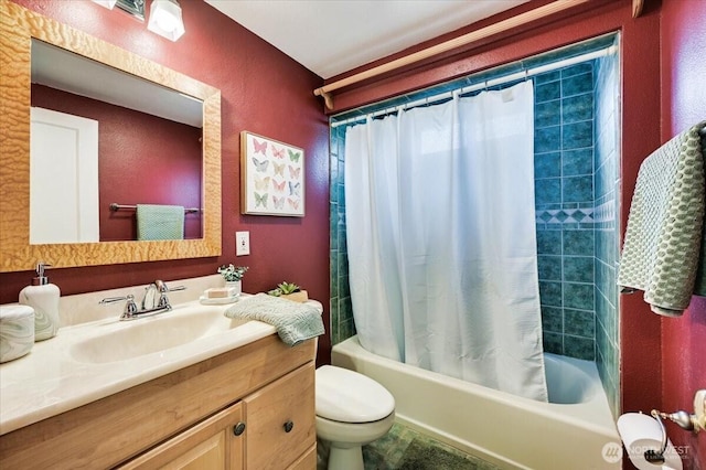 full bathroom with shower / bath combo, toilet, vanity, and a textured wall