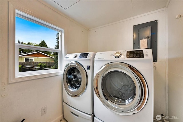 laundry area with washer and dryer and electric panel