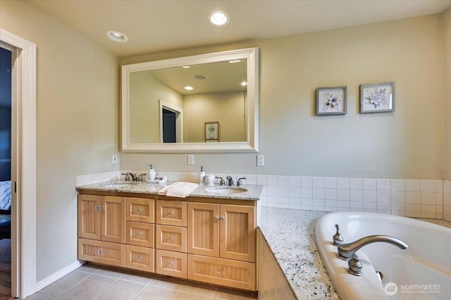 bathroom featuring a garden tub, double vanity, tile patterned flooring, and recessed lighting