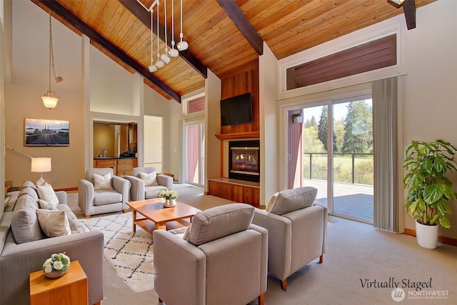 living area featuring wooden ceiling, a large fireplace, beam ceiling, carpet flooring, and high vaulted ceiling