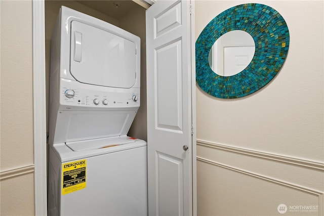 washroom with laundry area and stacked washer and dryer