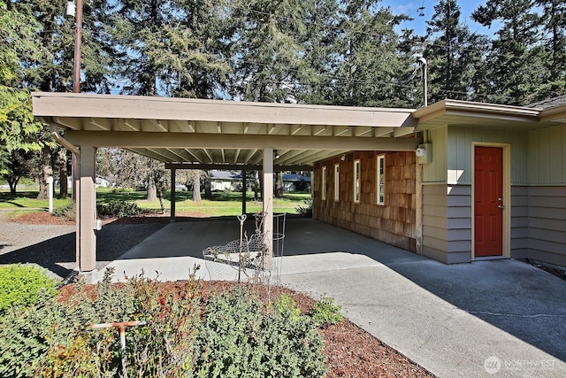 exterior space featuring driveway and an attached carport