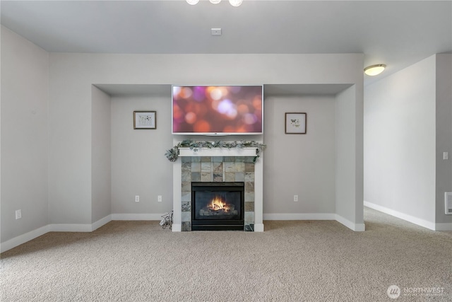 15700 116th Ave NE Unit 205, Bothell, WA 98011 - unfurnished living room with a fireplace, carpet floors, and baseboards